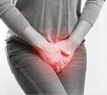 Pregnant woman experiencing pelvic pain, holding her lower abdomen.