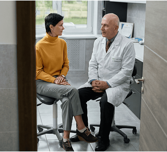 Doctor discussing health concerns with a female patient during a medical appointment.