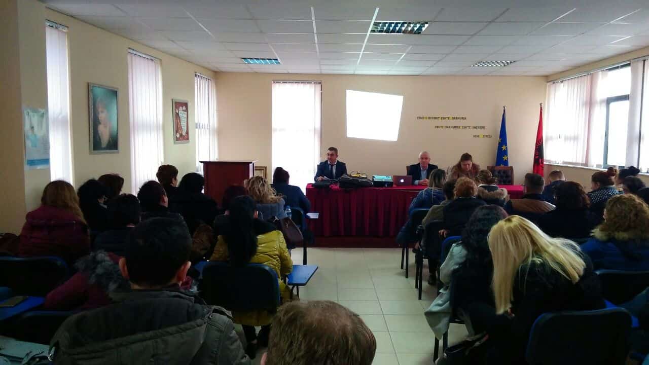 Healthcare professionals attending a gynecology and obstetrics conference in a conference room.